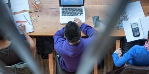 Aerial view of students studying together at a communal desk